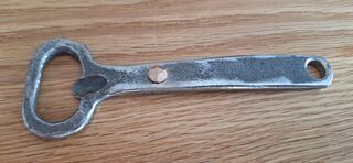 Bottle opener with rivet detail